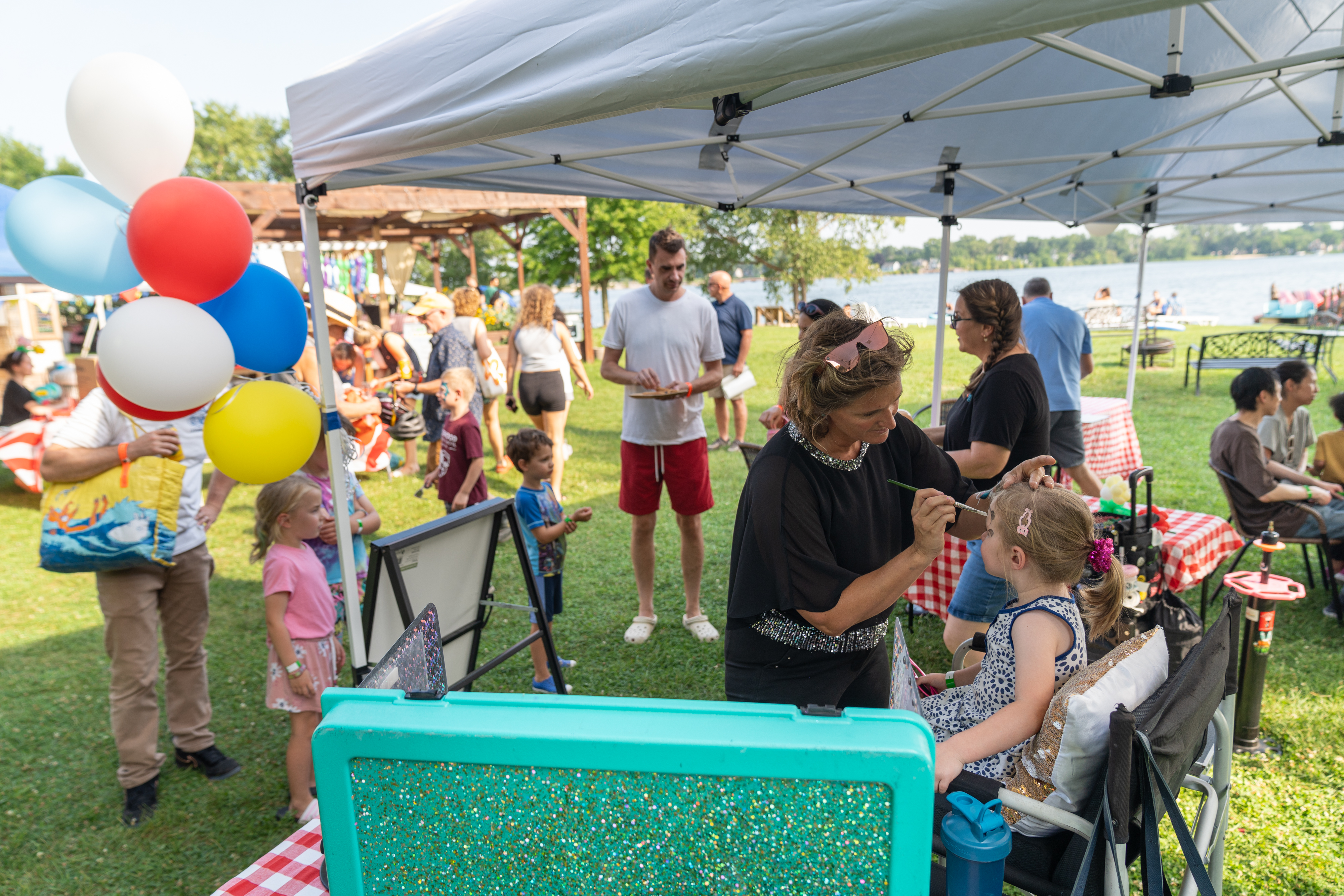 Crowds enjoying the ULI Fun Fair in downtown Madison with booths and games