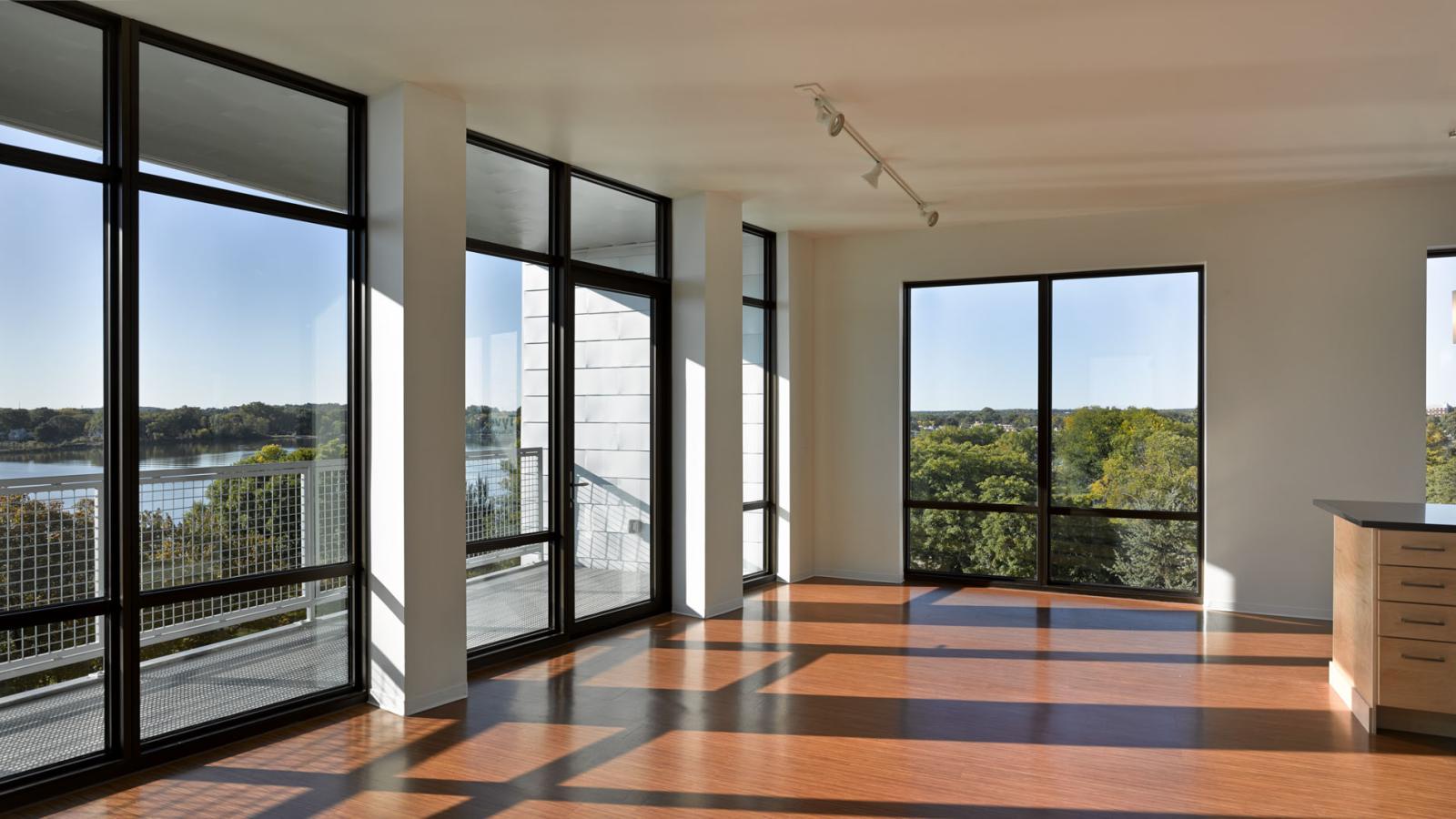 ULI Seven27 Apartments - Living room with lake view and direct sunlight