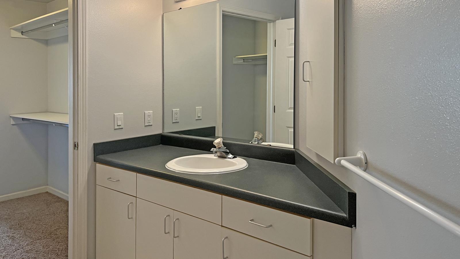 Classic bathroom with traditional fixtures at City Place Apartments