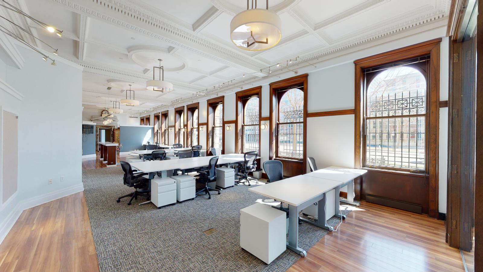 Dream Bank interior with abundant natural light streaming through large windows at American Exchange 