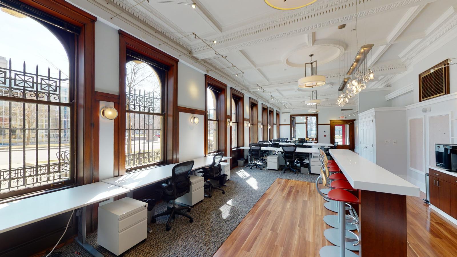 Dream Bank interior with abundant natural light streaming through large windows at American Exchange 
