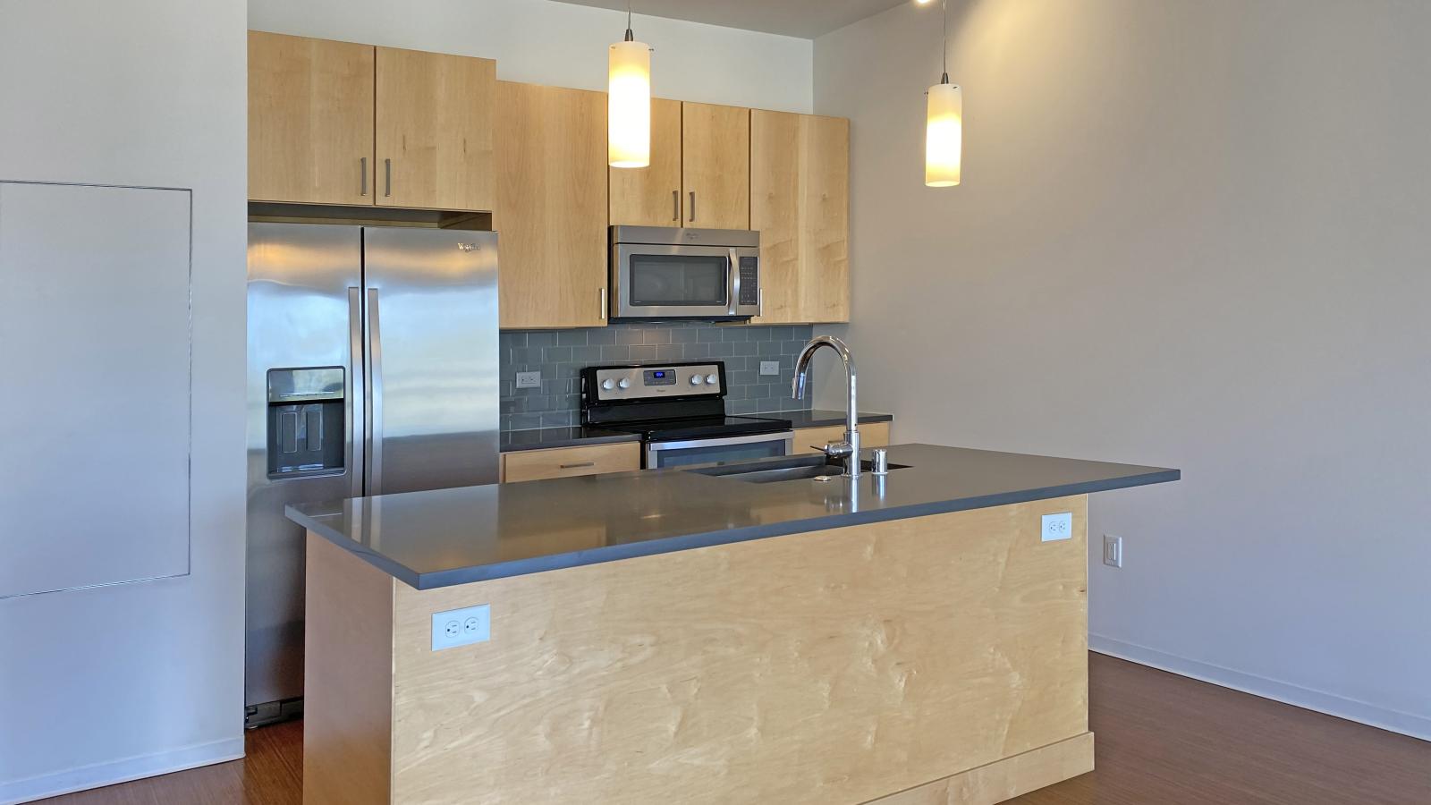 Two bedroom apartment kitchen featuring ample counter space and luxury finishes at SEVEN27