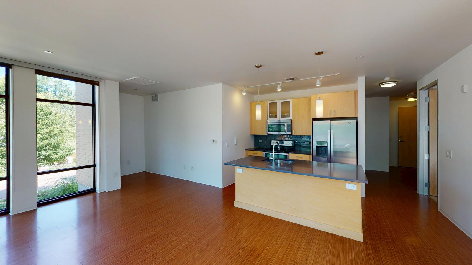 Luxury two bedroom apartment spacious kitchen with large island and modern fixtures at SEVEN27 in downtown Madison