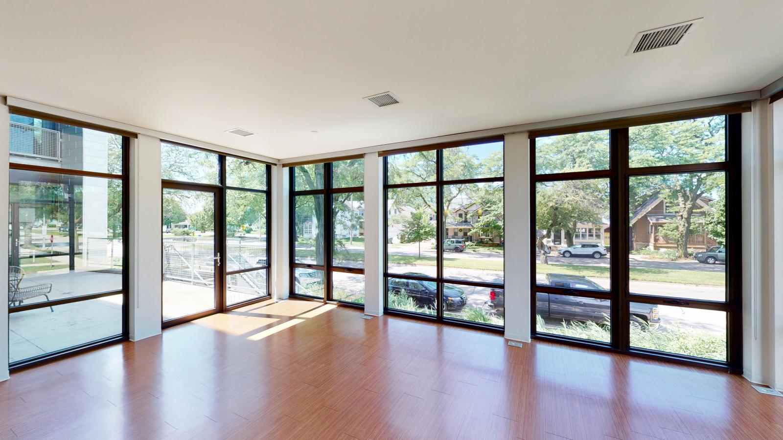 Modern two bedroom apartment with open living space, floor to ceiling windows and large patio at SEVEN27 in downtown Madison