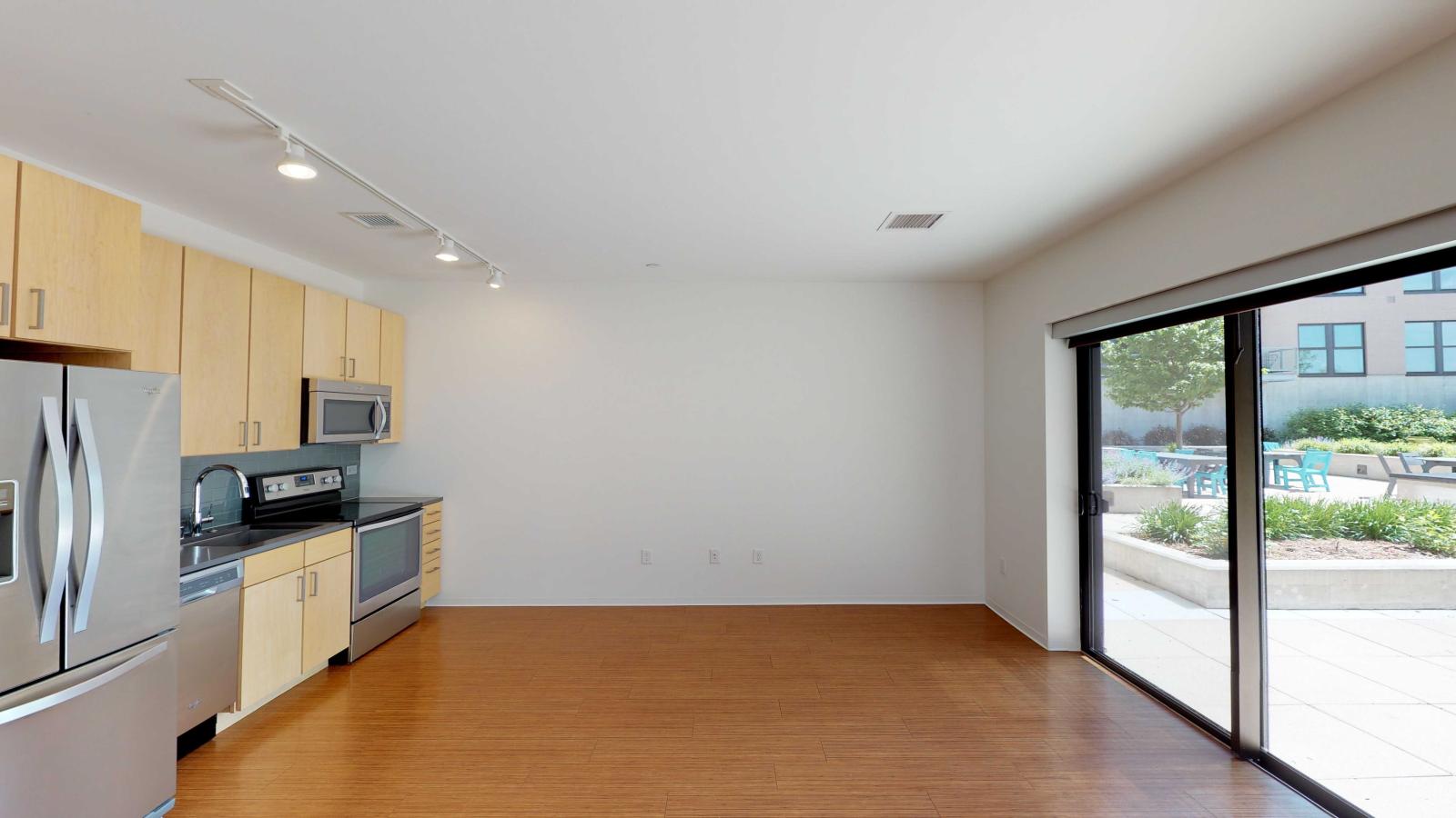 Open concept studio apartment with natural light and patio at SEVEN27