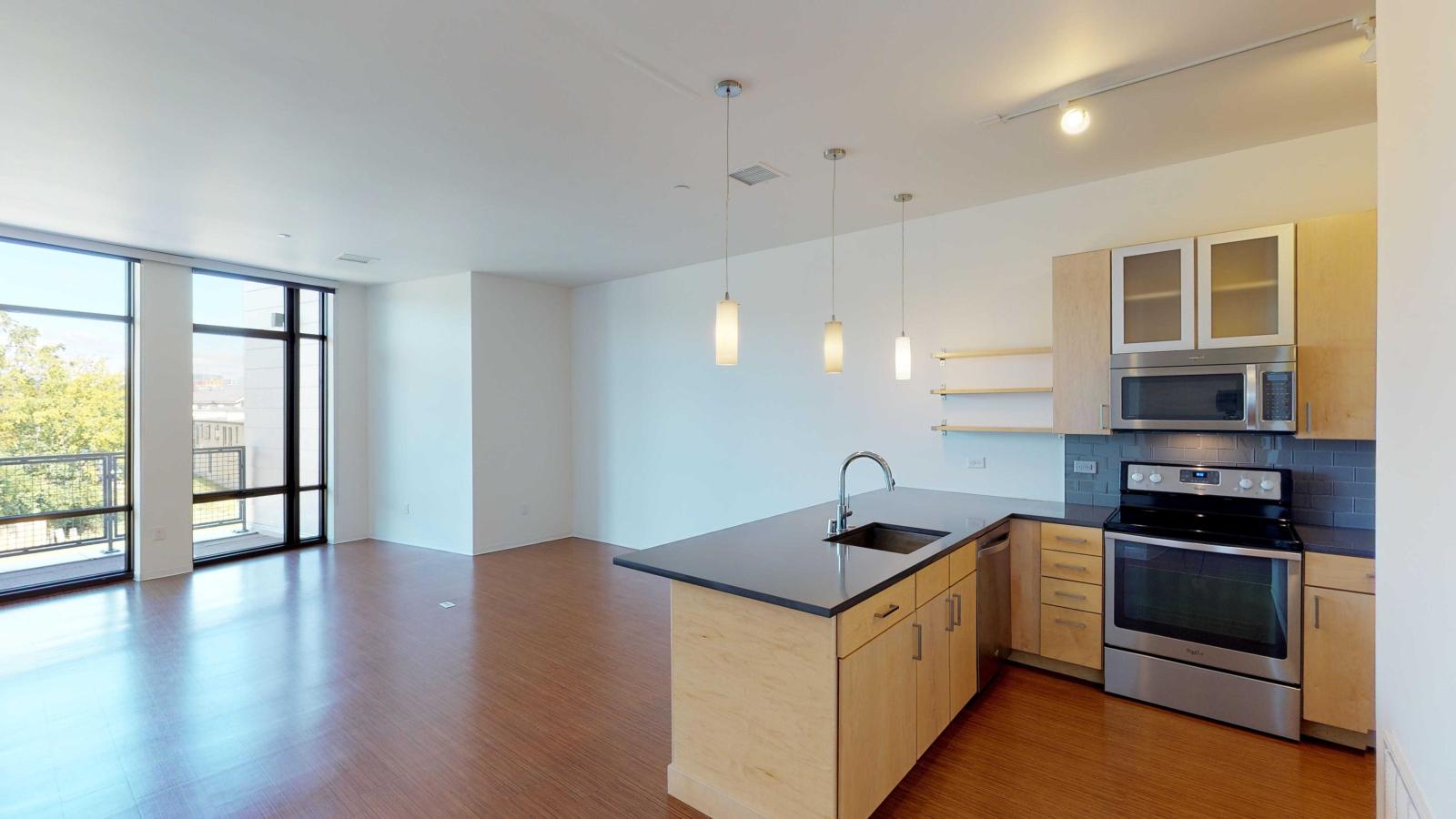 Two bedroom apartment kitchen featuring ample counter space and luxury finishes at SEVEN27