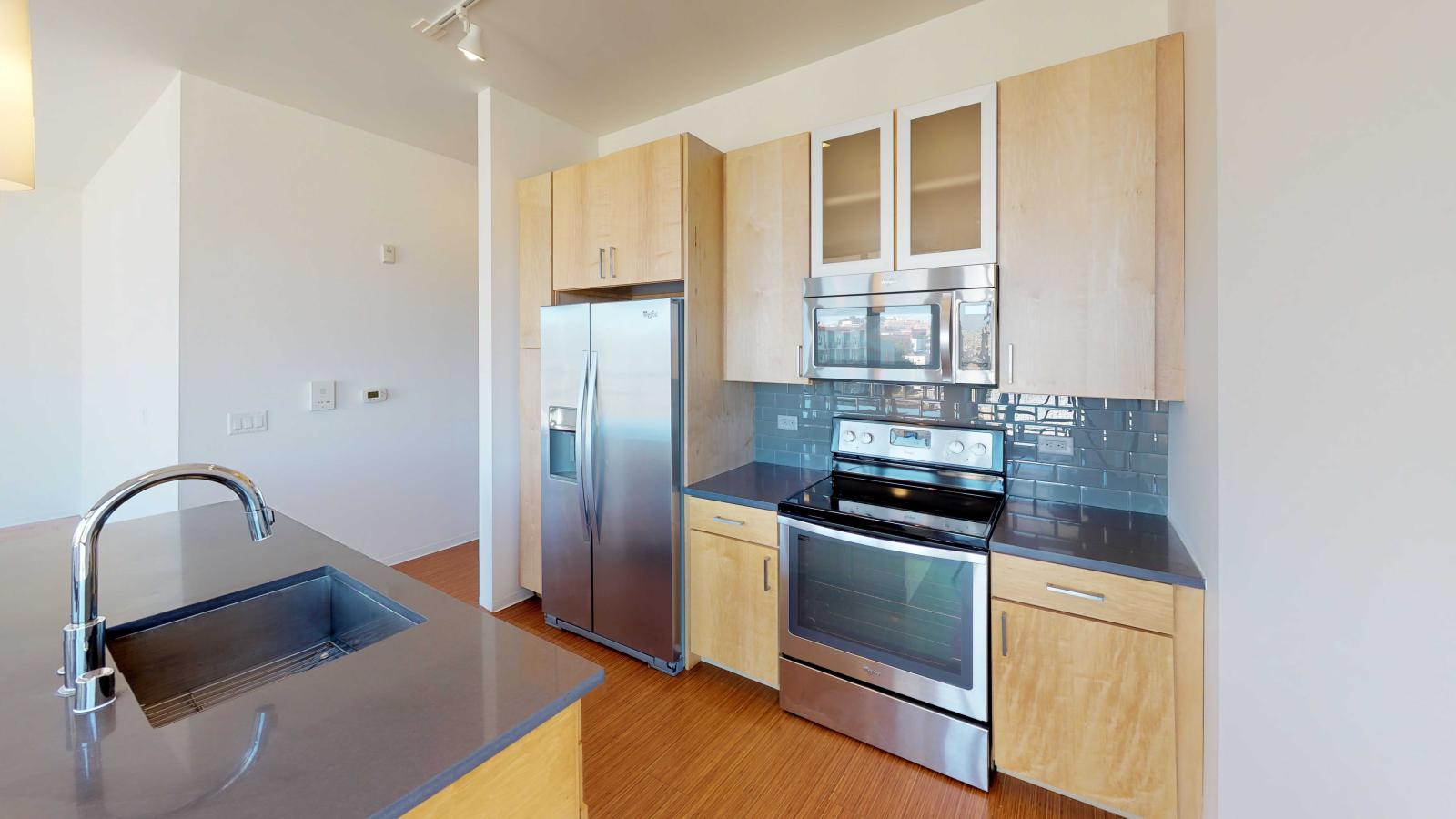 Two bedroom apartment kitchen featuring ample counter space and luxury finishes at SEVEN27
