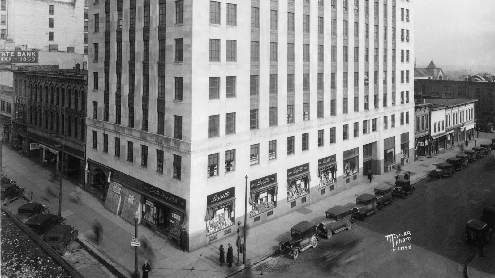 Historic photo of Tenney Plaza showing original buildings surrounding in downtown Madison
