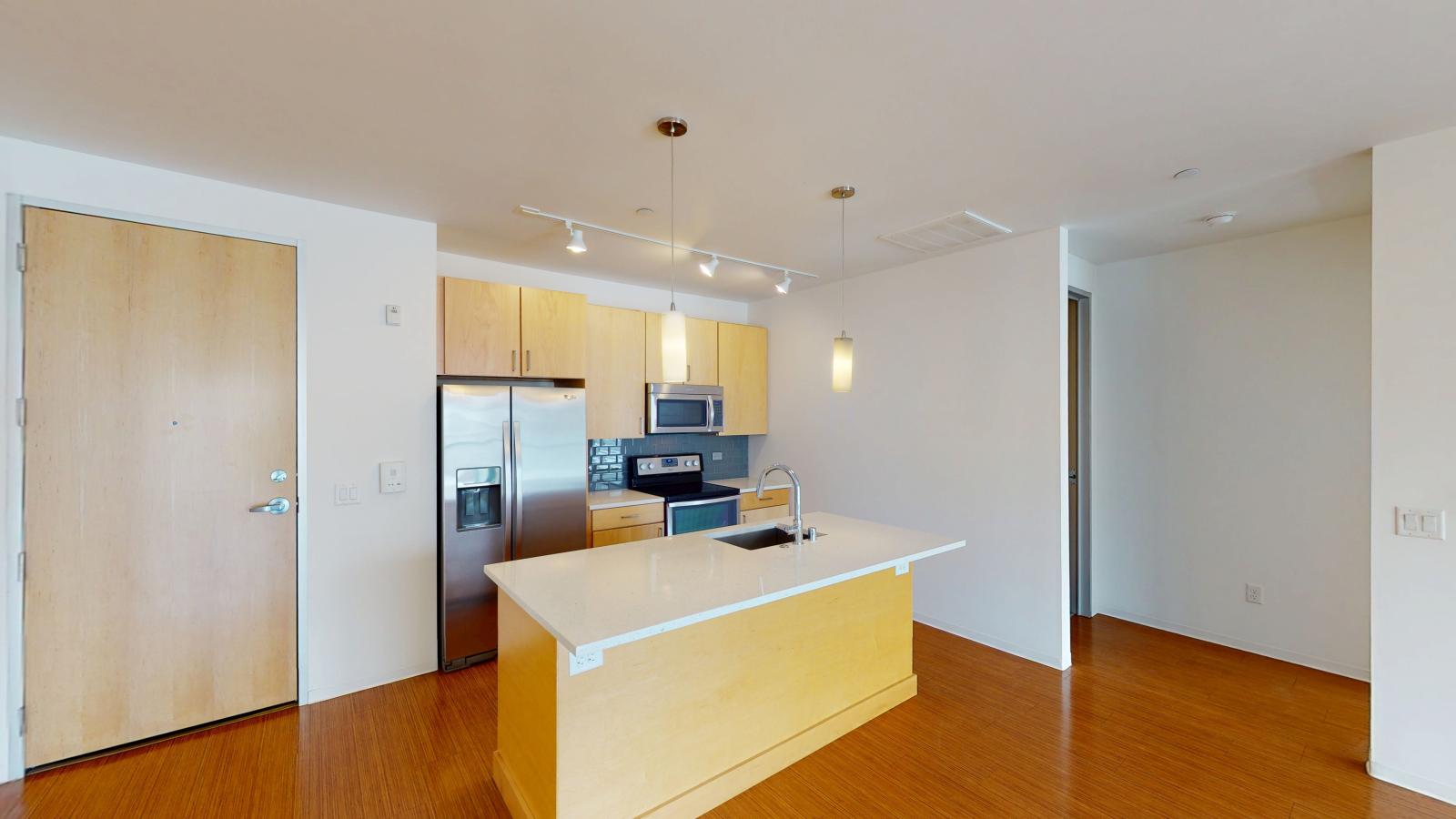Modern One bedroom apartment with private balcony and spacious living area at SEVEN27 in downtown Madison