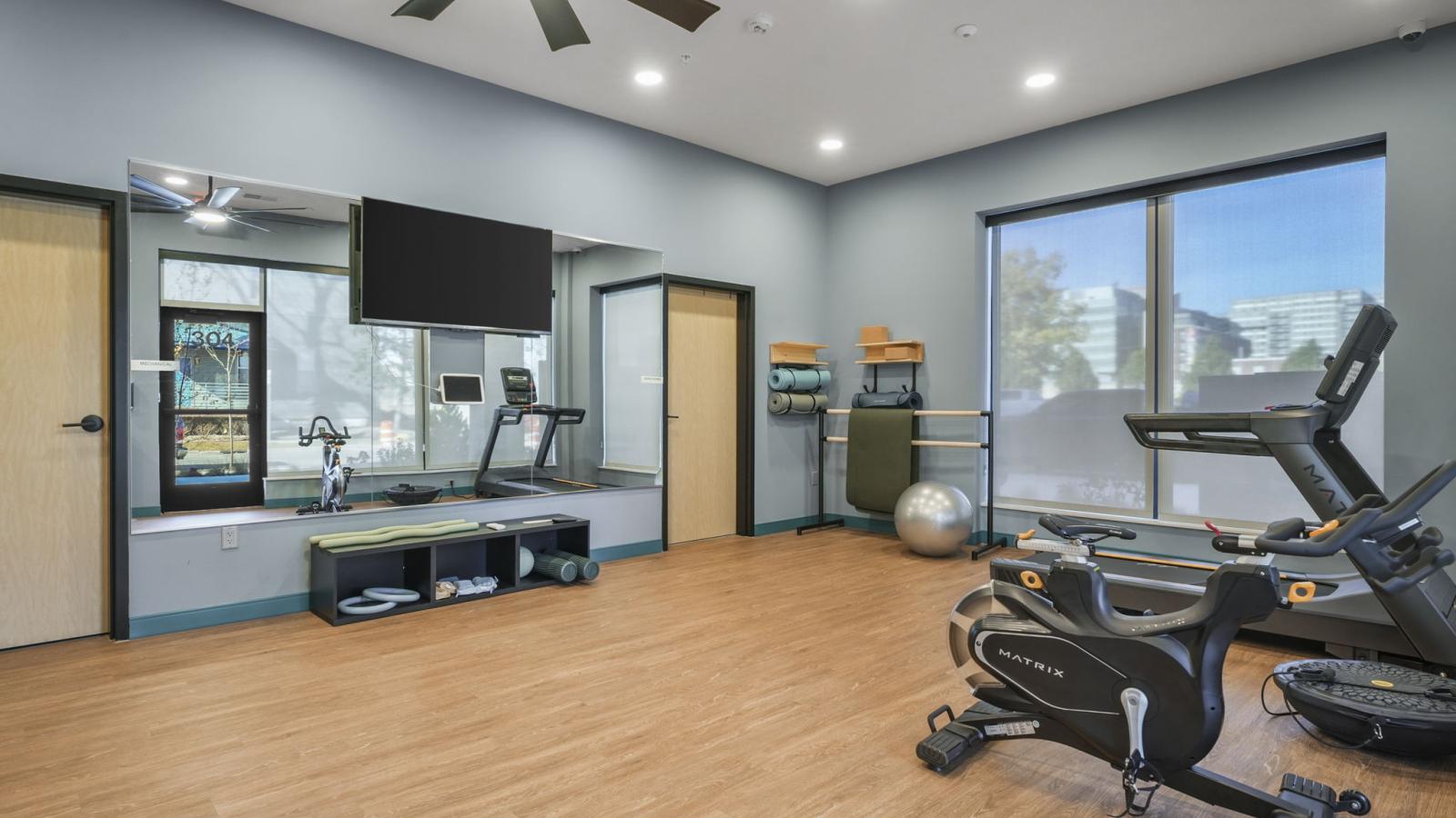 The Irwin wellness room featuring Pilates equipment, sauna, and space for stretching and recovery