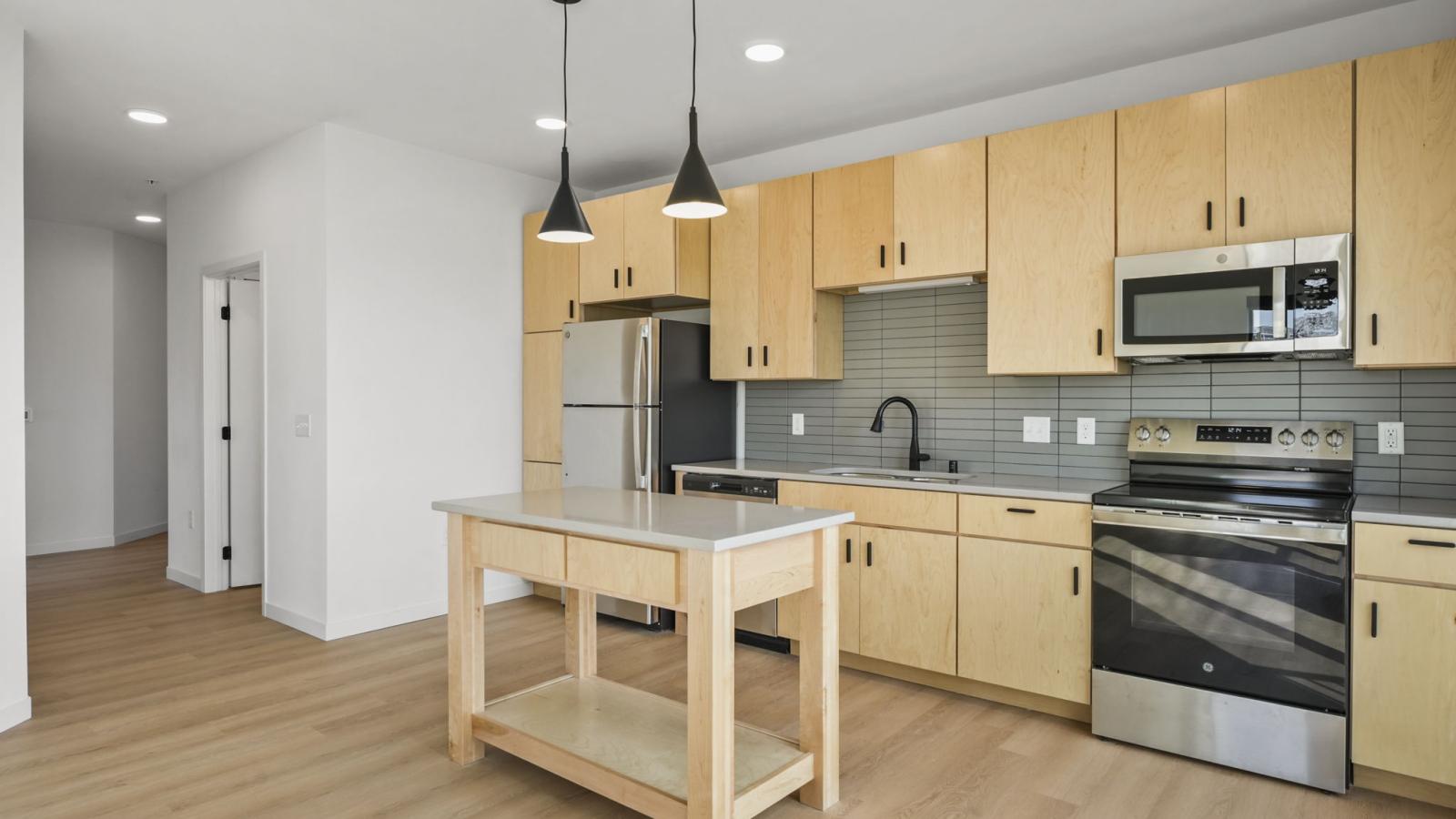 Kitchen interior at The Irwin with clean finishes, cabinetry, and functional layout